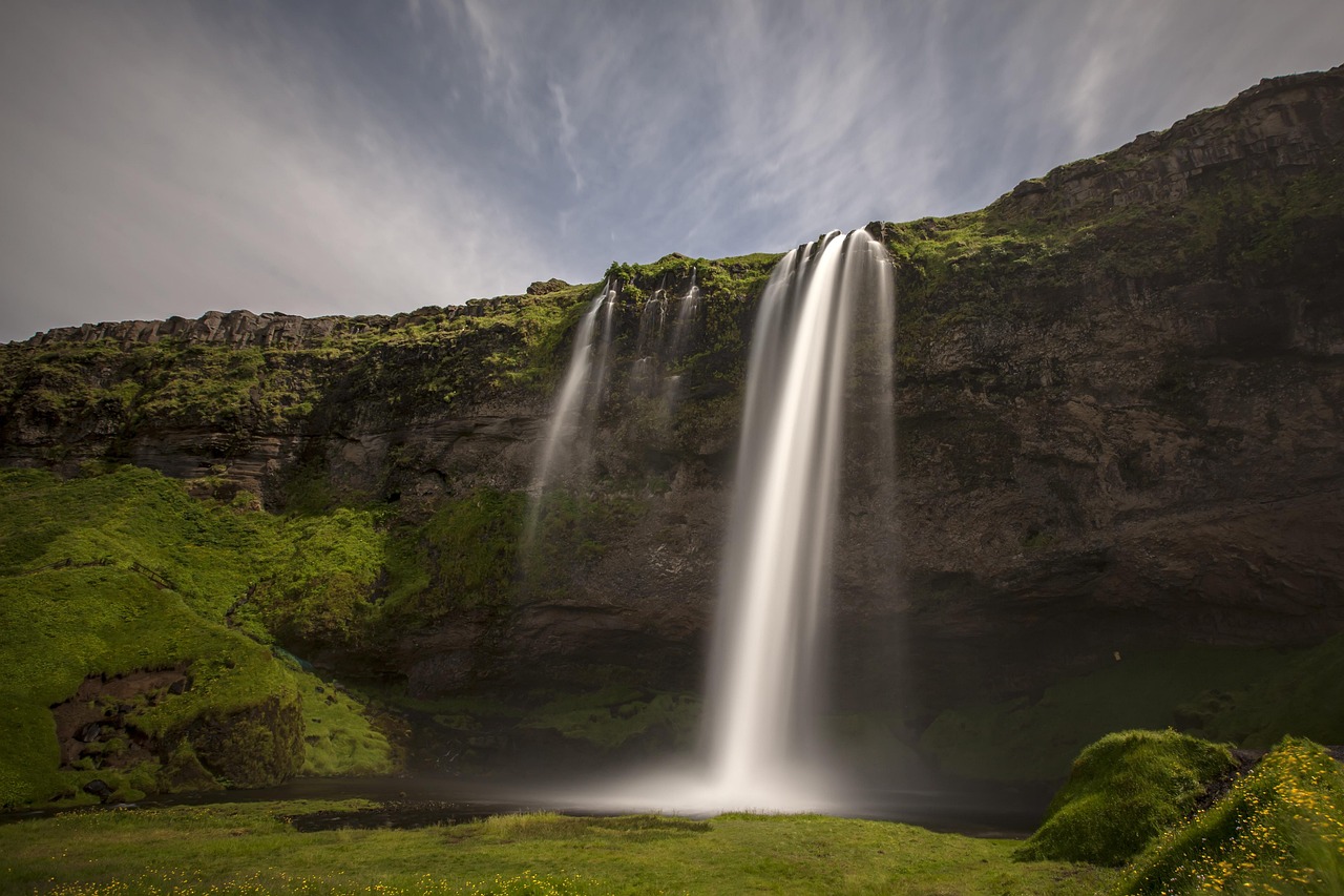 Seljalandsfoss waterfall in Iceland, famous for the walking path behind the cascading water